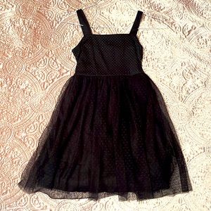 black sleeveless dress with gold sequin detail